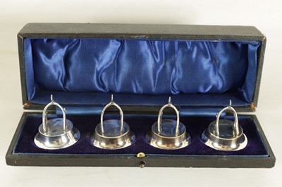 Lot 331 - A CASED SET OF FOUR SILVER WISH BONE MENU HOLDERS