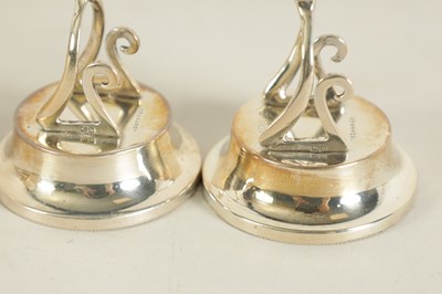 Lot 331 - A CASED SET OF FOUR SILVER WISH BONE MENU HOLDERS
