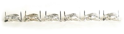 Lot 380 - A SET OF SIX SILVER PARROT MENU HOLDERS
