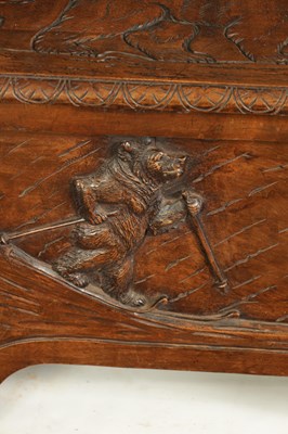 Lot 1037 - AN EARLY 20TH CENTURY CARVED LINDEN WOOD BLACK FOREST HALL BENCH