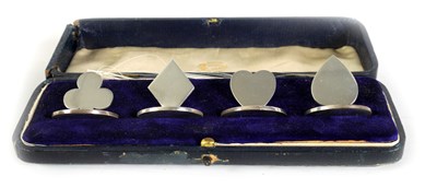 Lot 441 - A CASED SET OF FOUR SILVER 'BRIDGE' SUIT MENU HOLDERS