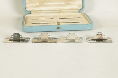 Lot 402 - A CASED SET OF FOUR ASPREY ART DECO SILVER MENU HOLDERS