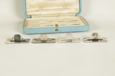 Lot 402 - A CASED SET OF FOUR ASPREY ART DECO SILVER MENU HOLDERS