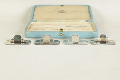 Lot 402 - A CASED SET OF FOUR ASPREY ART DECO SILVER MENU HOLDERS