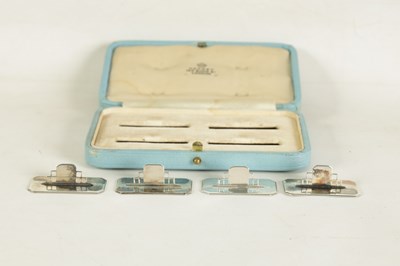 Lot 402 - A CASED SET OF FOUR ASPREY ART DECO SILVER MENU HOLDERS