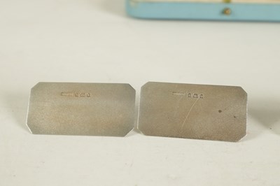 Lot 402 - A CASED SET OF FOUR ASPREY ART DECO SILVER MENU HOLDERS