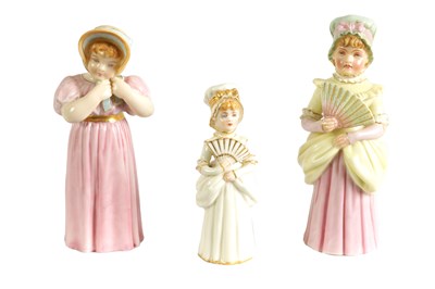 Lot 42 - TOWN GIRL AND COUNTRY GIRL. THREE ROYAL WORCESTER CANDLE EXTINGUISHERS