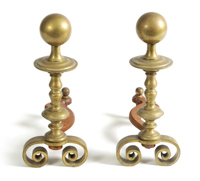 Lot 1036 - A PAIR OF EARLY 19TH CENTURY TURNED BRASS AND IRON FIRE DOGS