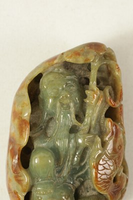 Lot 102 - A CHINESE RUSSET JADE CARVED AND PIERCED SCULPTURE