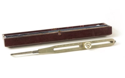 Lot 405 - A CASED ADJUSTABLE PROPORTIONAL SILVERED COMPASS BY W.F. STANLEY, LONDON