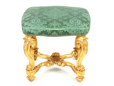 Lot 1334 - AN 18TH CENTURY CARVED GILTWOOD STOOL WITH PERIOD SILK DAMASK SEAT
