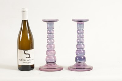 Lot 8 - A PAIR OF EARLY 20TH CENTURY IRIDESCENT AUBERGINE GLASS CANDLESTICKS