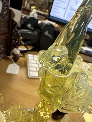 Lot 14 - A DECORATIVE 19TH CENTURY VASELINE GLASS TWO BRANCH CANDLE HOLDER