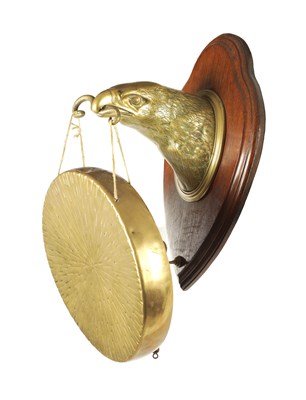Lot 697 - A LATE 19TH CENTURY WILLIAM TONKS AND SON DINNER GONG FORMED AS A BRASS EAGLE'S HEAD