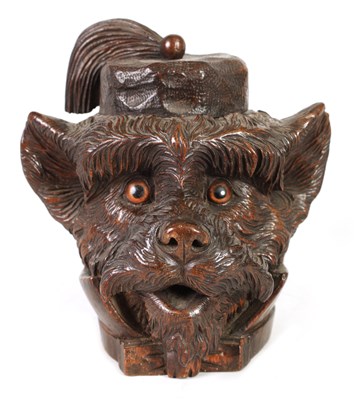 Lot 1155 - A LATE 19TH CENTURY BLACK FOREST CARVED TOBACCO JAR