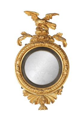 Lot 1250 - A REGENCY CARVED GILT GESSO CONVEX MIRROR OF SMALL SIZE