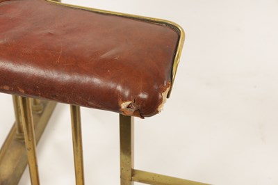 Lot 512 - A LATE 19TH CENTURY BRASS CLUB HEARTH FENDER