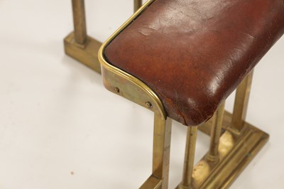 Lot 512 - A LATE 19TH CENTURY BRASS CLUB HEARTH FENDER
