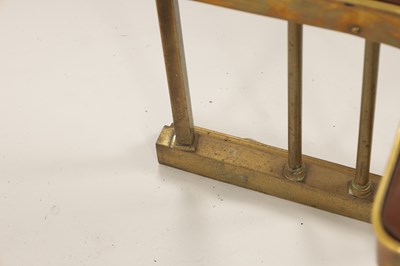 Lot 512 - A LATE 19TH CENTURY BRASS CLUB HEARTH FENDER