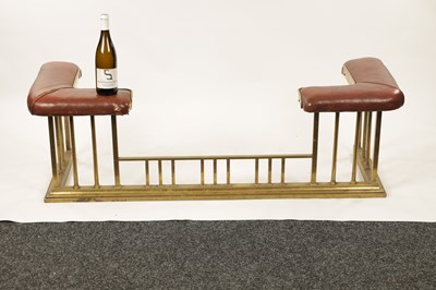 Lot 512 - A LATE 19TH CENTURY BRASS CLUB HEARTH FENDER