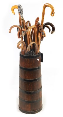 Lot 485 - A SELECTION OF 19TH AND 20TH CENTURY WALKING STICKS TOGETHER WITH A TAPERED OAK AND IRON COOPERED STICK STAND