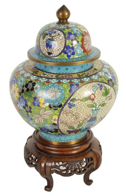 Lot 308 - A LATE 19TH CENTURY CHINESE CLOISONNÉ ENAMEL JAR AND COVER ON CARVED WOOD STAND