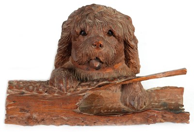 Lot 871 - A 19TH CENTURY BLACK FOREST CARVED LINDENWOOD INKWELL FORMED AS DOG RESTING ON A LOG
