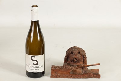 Lot 871 - A 19TH CENTURY BLACK FOREST CARVED LINDENWOOD INKWELL FORMED AS DOG RESTING ON A LOG
