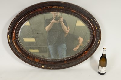 Lot 1714 - A 19TH CENTURY CHINOISERIE DECORATED OVAL LACQUERED HANGING MIRROR