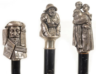 Lot 466 - THREE 20TH CENTURY SILVER METAL MOUNTED EBONISED WALKING CANES
