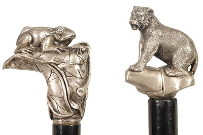 Lot 479 - TWO .925 HALLMARKED SILVER TOPPED EBONISED WALKING CANES WITH CAST HANDLES