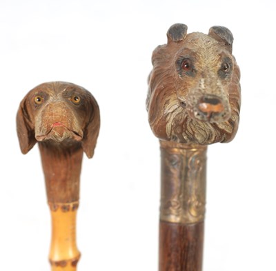 Lot 457 - TWO EARLY 20TH CENTURY DOG’S HEAD HANDLED WALKING STICKS