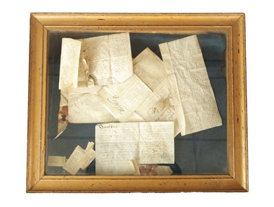 Lot 718 - A CASED FRAMED SET OF EARLY HANDWRITTEN MANUSCRIPTS