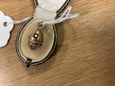 Lot 274 - A LATE 19TH CENTURY FABERGE 14CT GOLD ENAMEL AND RUBY PENDANT EGG, WORKMASTER HENRIK WIGSTROM