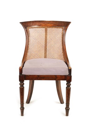 Lot 1167 - A REGENCY SIMULATED ROSEWOOD BERGERE LIBRARY CHAIR