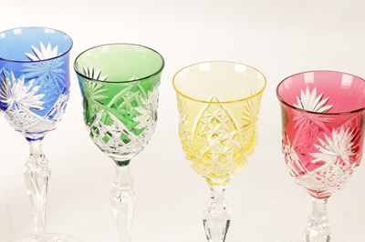 Lot 2 - A SET OF EIGHT 20TH CENTURY COLOURED CUT GLASS WINE GLASSES