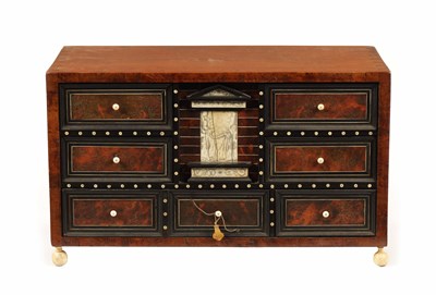Lot 1201 - A 17TH-CENTURY ITALIAN WALNUT TORTOISESHELL, EBONY AND IVORY DECORATED TABLE CABINET