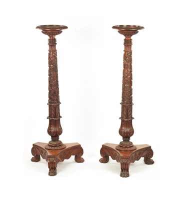 Lot 1269 - A PAIR OF REGENCY-CARVED MAHOGANY TORCHERES
