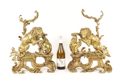 Lot 519 - A PAIR OF REGENCY ORMOLU CHENETS OF ROCOCO DESIGN