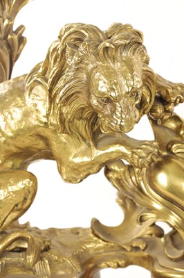 Lot 519 - A PAIR OF REGENCY ORMOLU CHENETS OF ROCOCO DESIGN