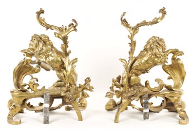 Lot 519 - A PAIR OF REGENCY ORMOLU CHENETS OF ROCOCO DESIGN