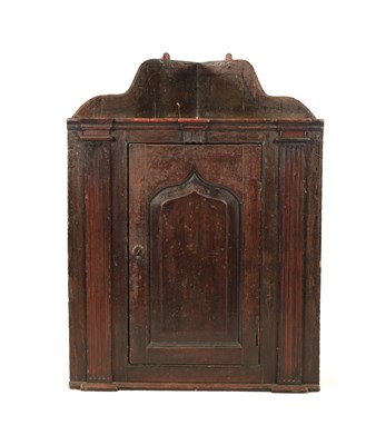 Lot 1254 - A MID 18TH CENTURY SCUMBLED PINE CORNER CUPBOARD OF SMALL SIZE