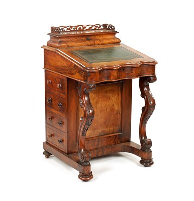 Lot 1345 - A 19TH CENTURY FIGURED WALNUT DAVENPORT