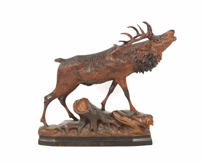 Lot 1121 - A LARGE EARLY 20TH CENTURY AUSTRIAN CARVED STAG