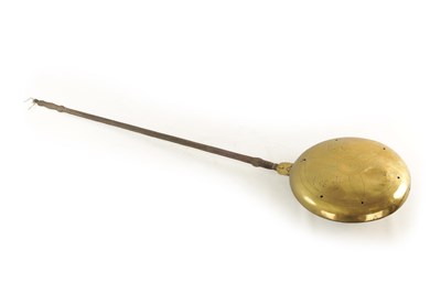 Lot 1165 - A 17TH CENTURY BRASS AND IRON WARMING PAN