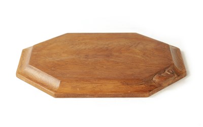 Lot 1101 - A ROBERT 'MOUSEMAN' THOMPSON MEDIUM OAK LIGHTLY ADZED BREADBOARD