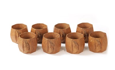 Lot 1099 - A GOOD SET OF EIGHT ROBERT 'MOUSEMAN' THOMPSON MEDIUM OAK SLIGHTLY ADZED SERVIETTE RINGS