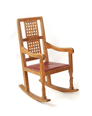 Lot 1104 - A ROBERT 'MOUSEMAN' THOMPSON ADZED OAK ROCKING CHAIR