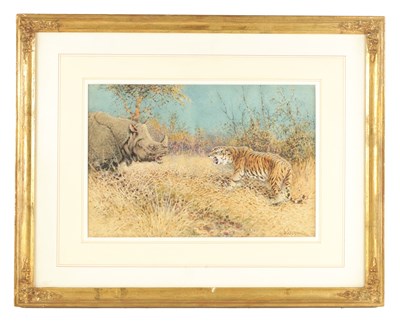 Lot 834 - WILLIAM WOODHOUSE (1857 - 1939) A WATERCOLOUR DEPICTING A TIGER AND A RHINOCEROS IN A GRASSY LANDSCAPE
