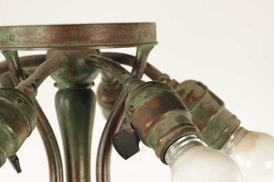 Lot 725 - TIFFANY & CO. NEW YORK. A LARGE STYLISH ART NOUVEAU GREEN PATINATED BRONZE TELESCOPIC AND STAINED GLASS TABLE LAMP